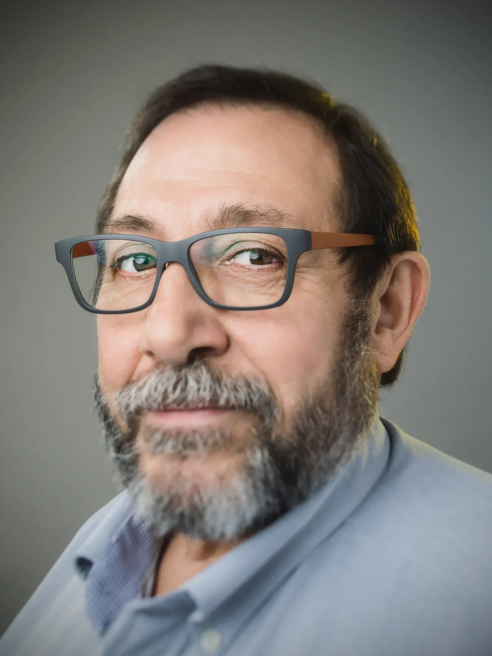 Man with glasses and a salt-and-pepper beard